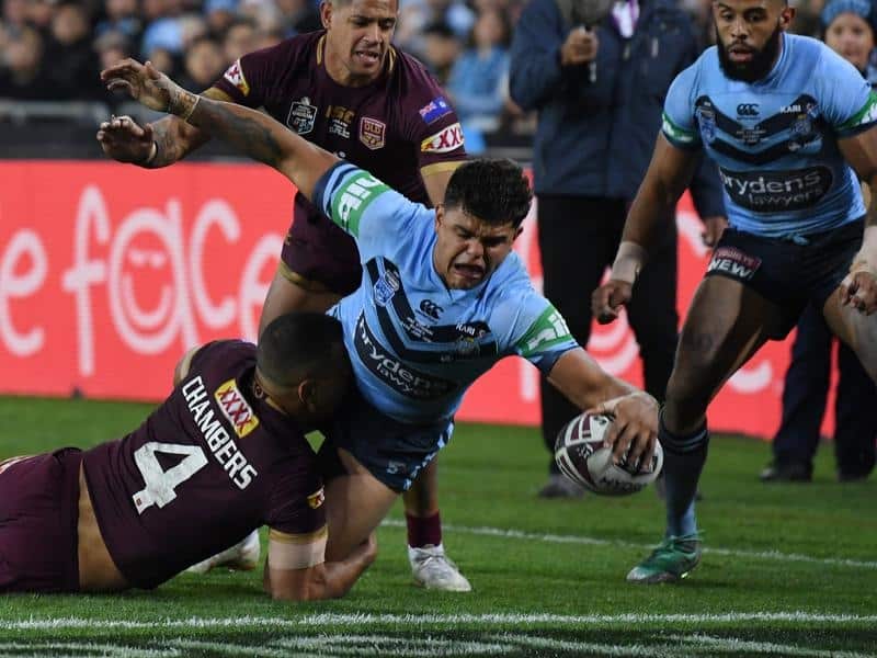 Latrell Mitchell of the Blues scores a try.