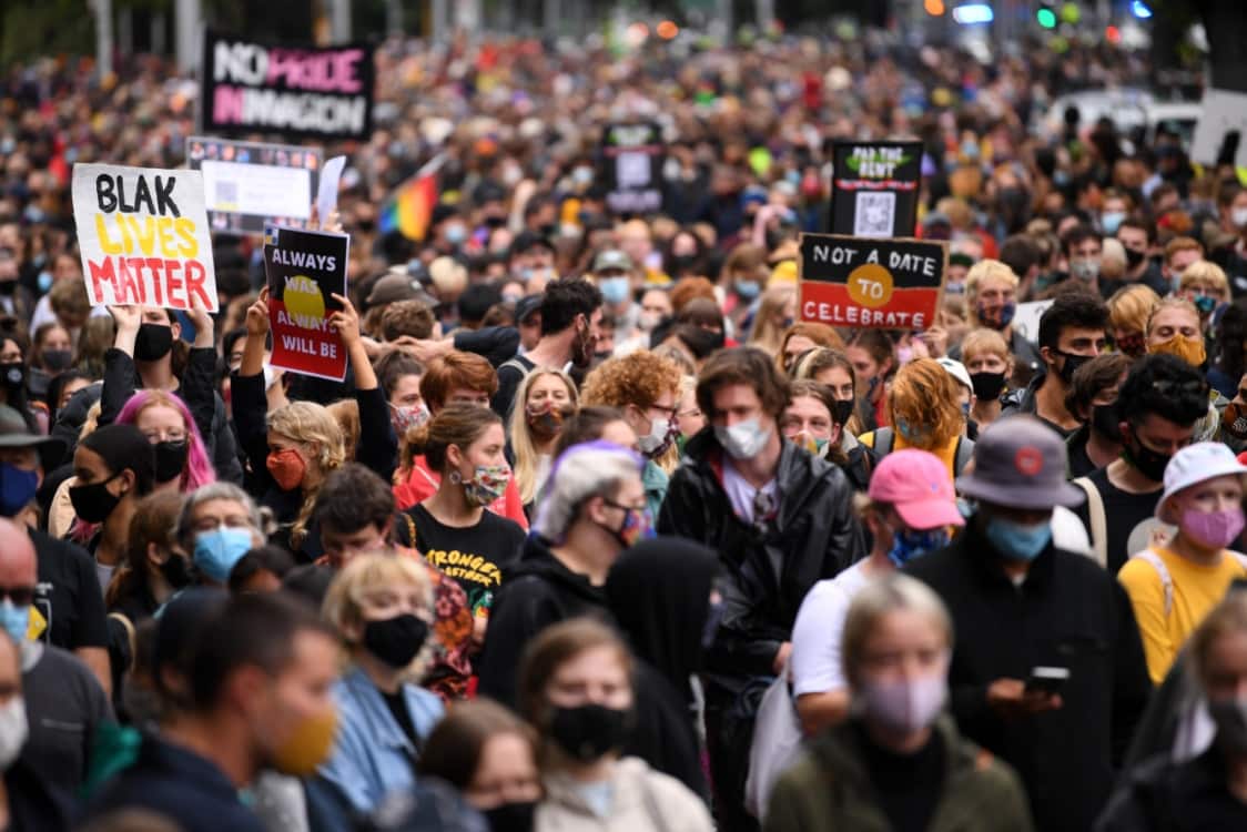 Protesters are seen during an Invasion Day rally in Melbourne. 