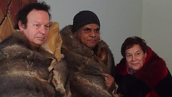 Edoardo Crismani (left) with Elder Gary Murray and Edoardo'smother wearing traditional possum skin cloaks.