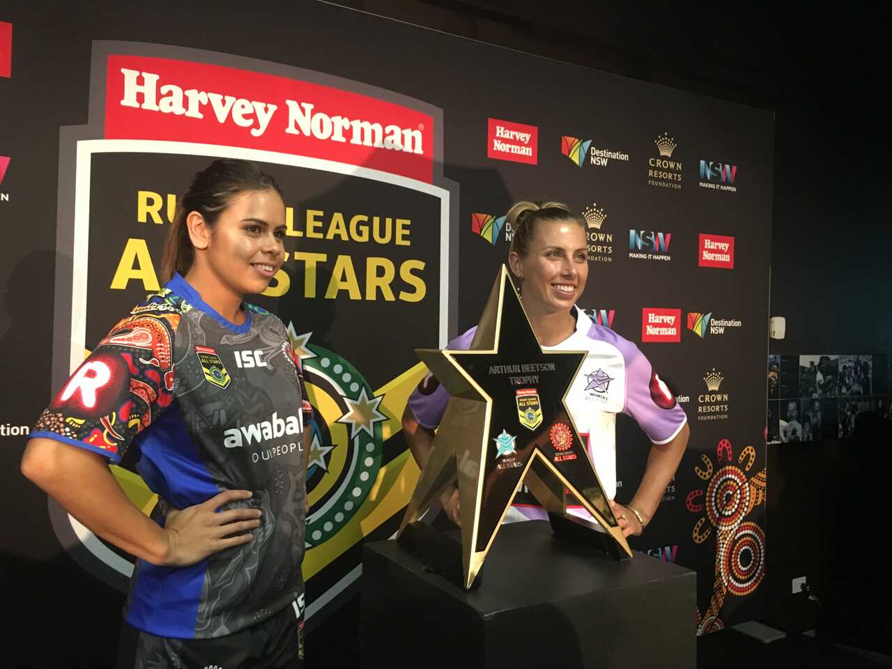 Nakia Davis-Welsh and Sam Bremner (World All Stars) with the Arthur Beetson trophy.