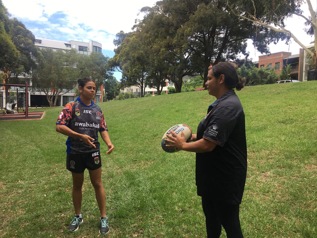 Jasmine and Nakia passing the ball.