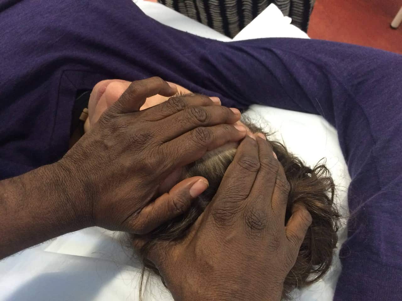 Ngangkari Healers helping a patient. 