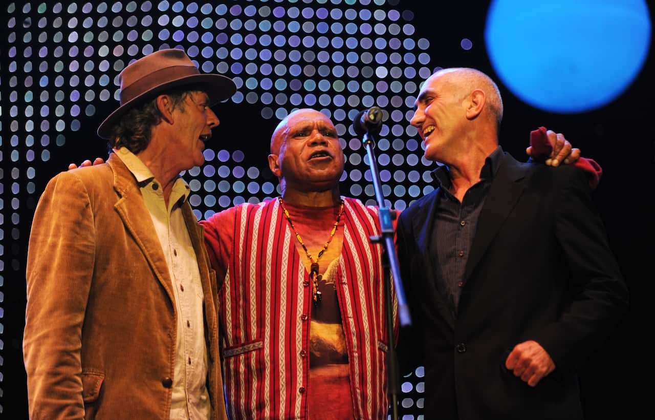 Australian musicians Shane Howard, Archie Roach (centre) and Paul Kelly (right) perform at The Domain for the Nukkan Ya Ruby (See Ya Later Ruby) tribute concert during the Sydney Festival First Night in Sydney on Saturday, Jan. 8, 2011.