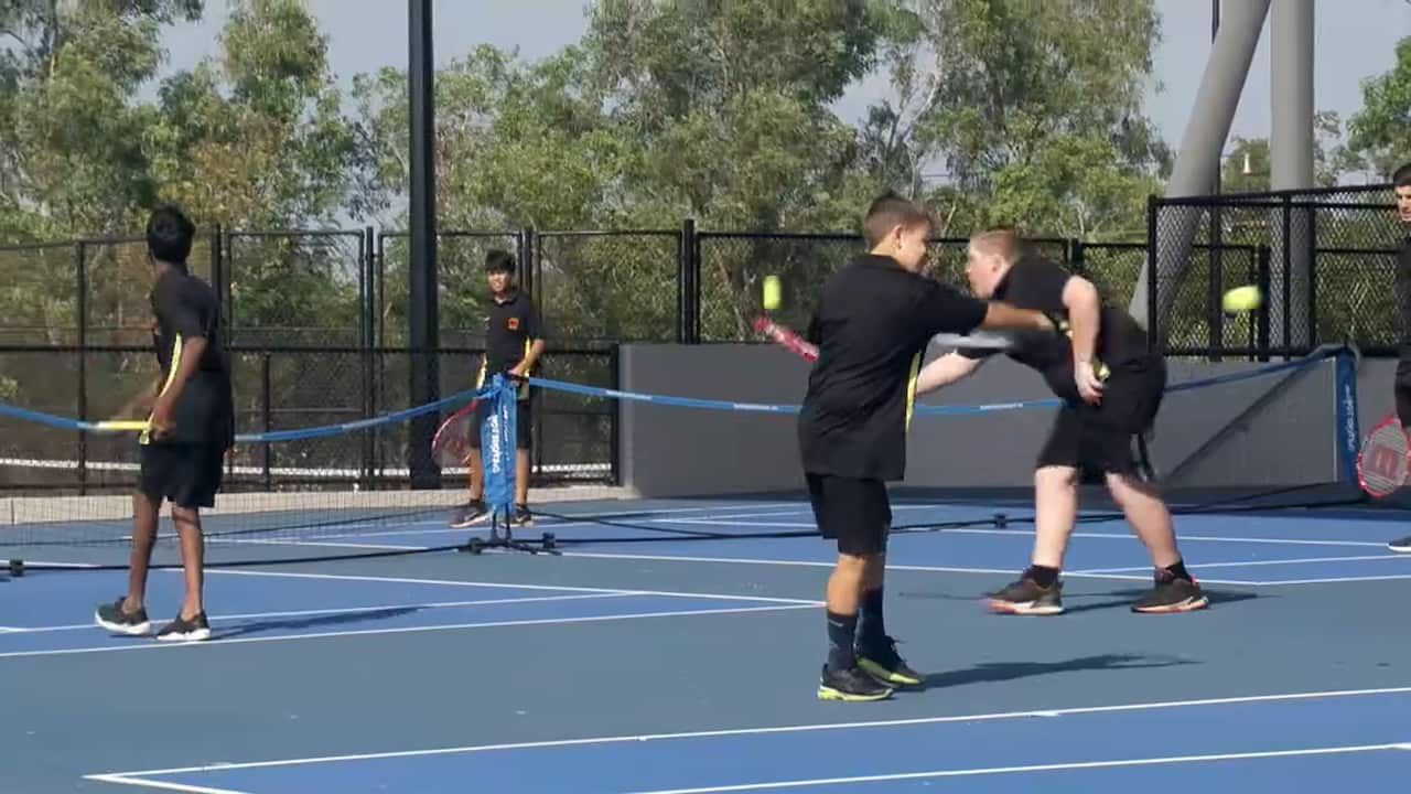 Young tennis players at the Darwin International Tennis Centre.