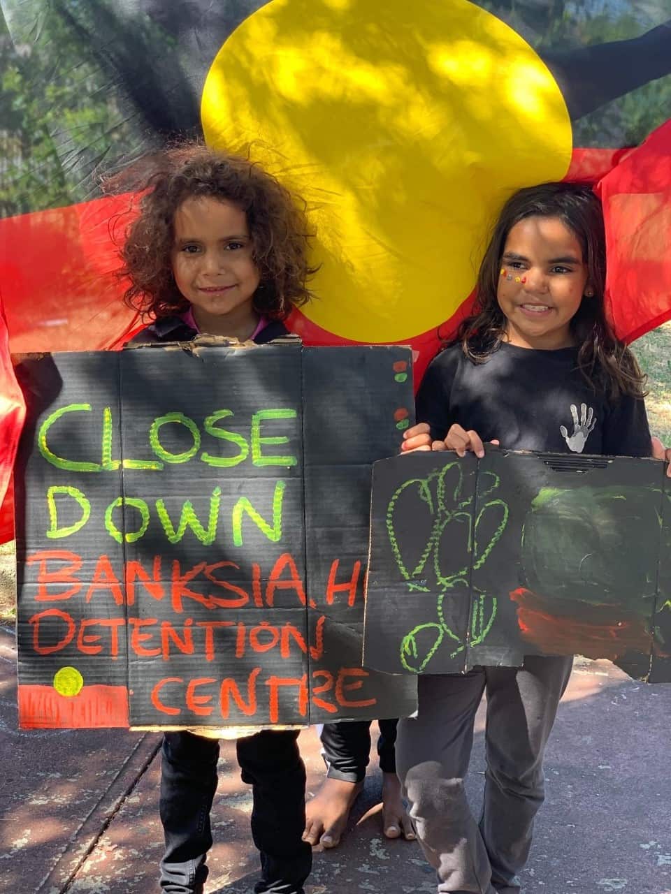 Young protestors supporting the call for a class action against the treatment of juvenile inmates. 