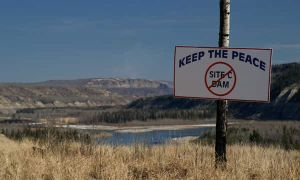 A protest sign at the Peace River in British Columbia