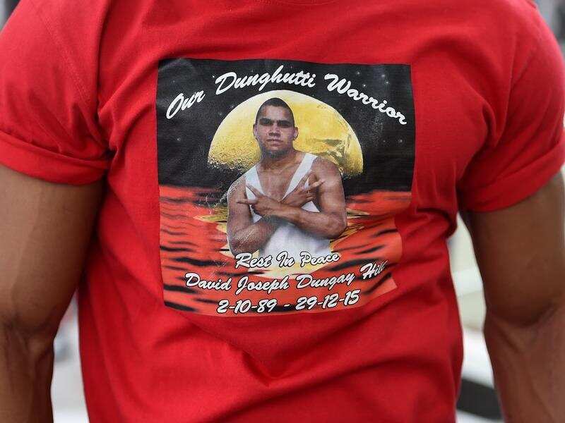 A man wearing a memorial shirt to David Dungay Jnr