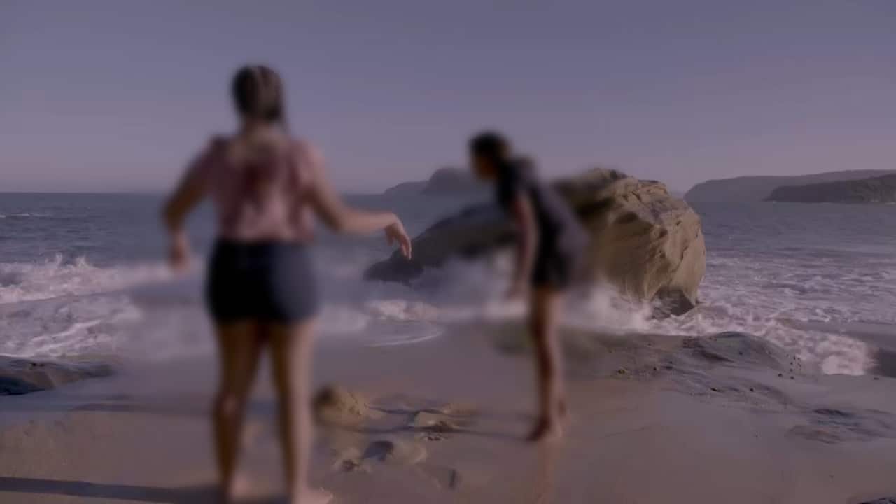 Aboriginal sisters on beach