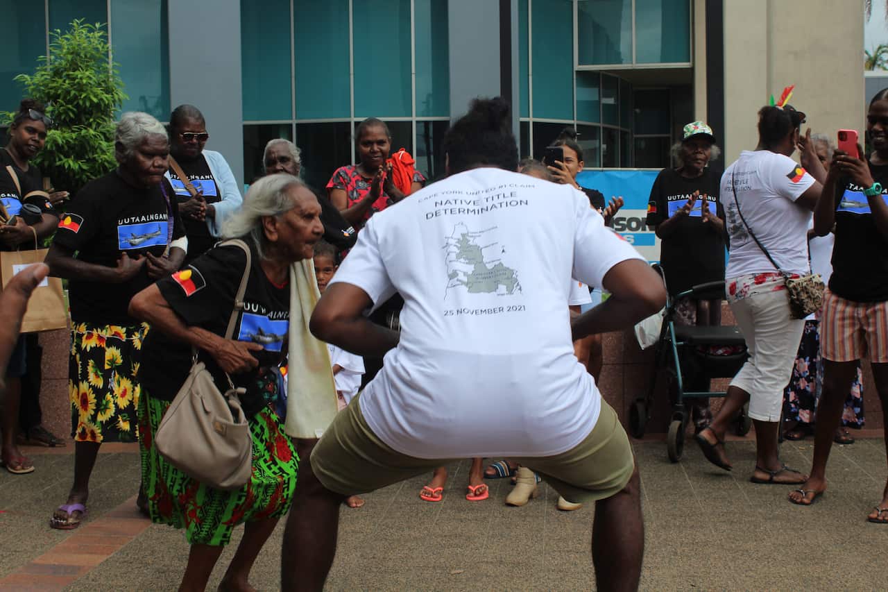 80 year old Beatrice Hobson dances with Solomon Accoom outside Cairns Supreme Court