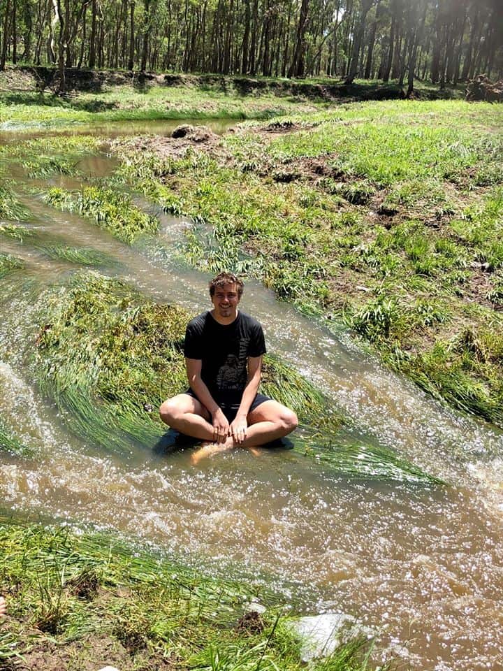 Callum Clayton-Dixon sits in a creek 10km from Armidale