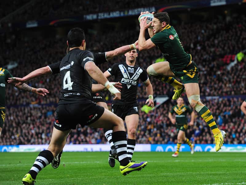 Australia's Billy Slater outjumps New Zealand's Kieran Foran