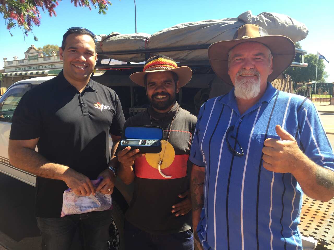 Clinton and his road crew Jimmy Ashwin receive a satellite phone from NITV .