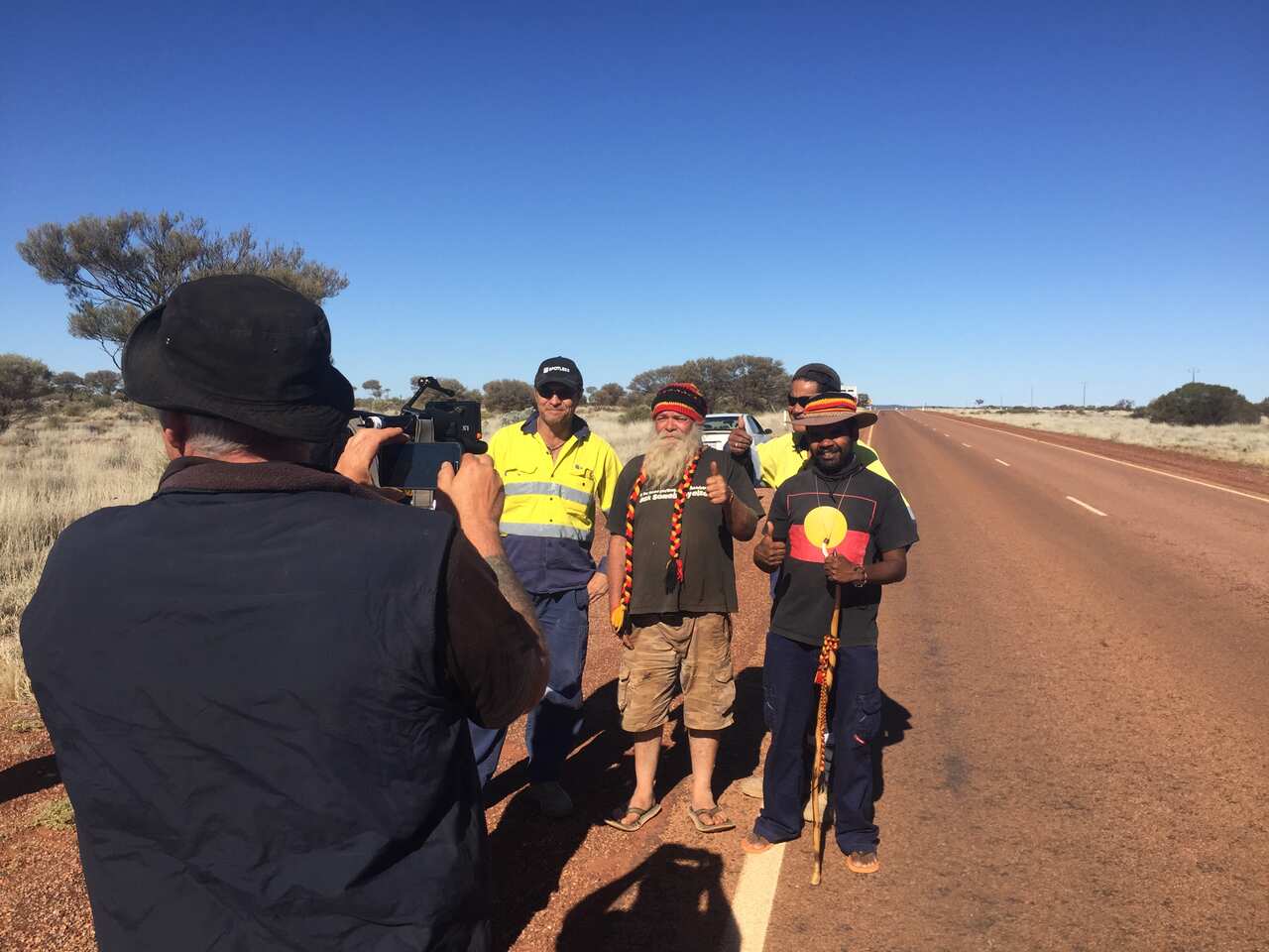 Local mine workers stop to show their support for Clinton Pryor as they pass him on the road.