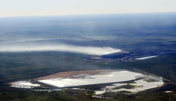 Clouds of sulphur dioxide being emitted from the gigantic waste rock pile at McArthur River Mine 2014. David Morris EDONT