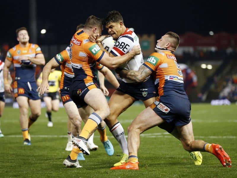 Roosters' Latrell Mitchell (centre) produced another standout display in the NRL win over Newcastle.