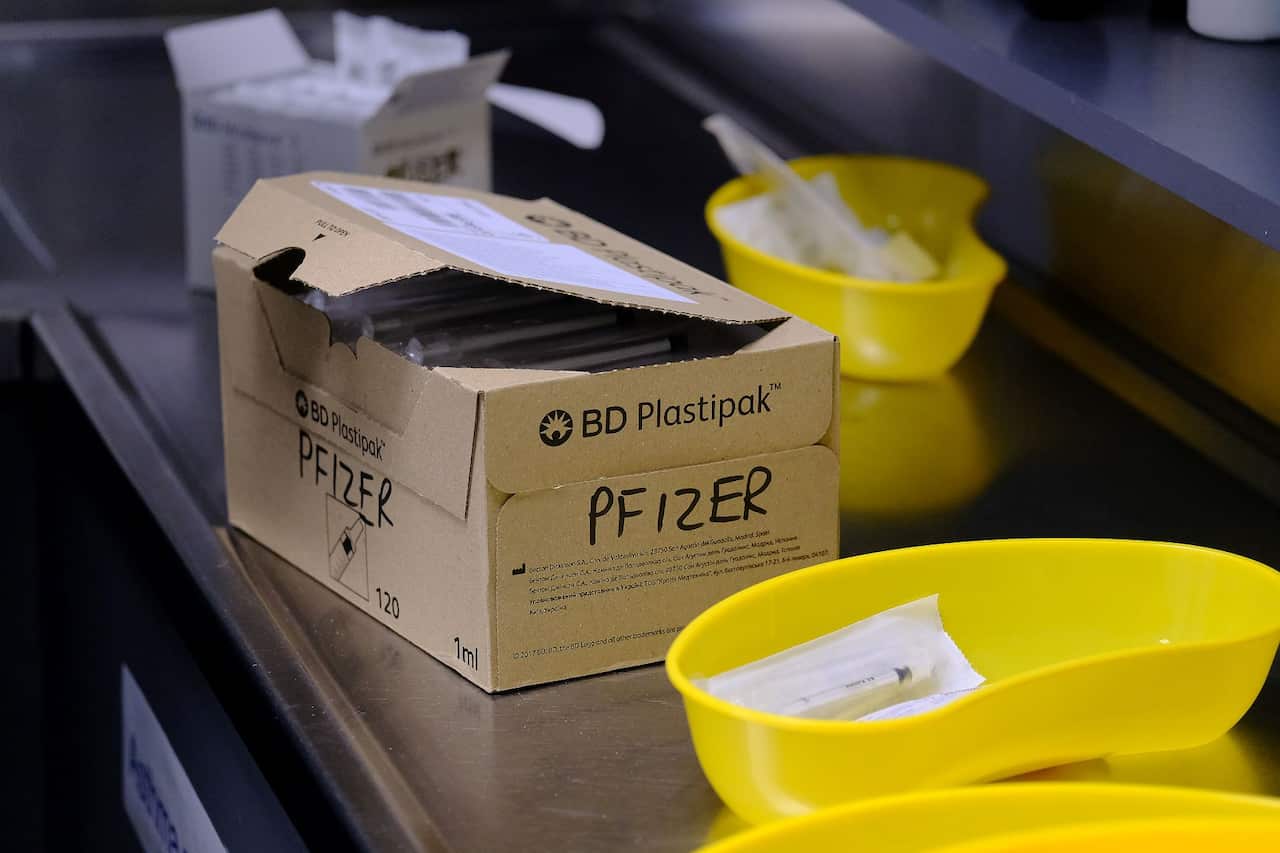Medical staff at Midtown Medical Clinic prepare the Pfizer vaccine, Monday, July 5, 2021.