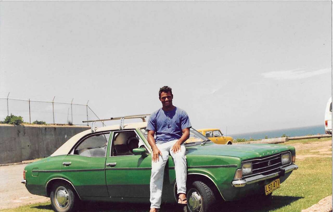 Eric Mercy sitting on a car