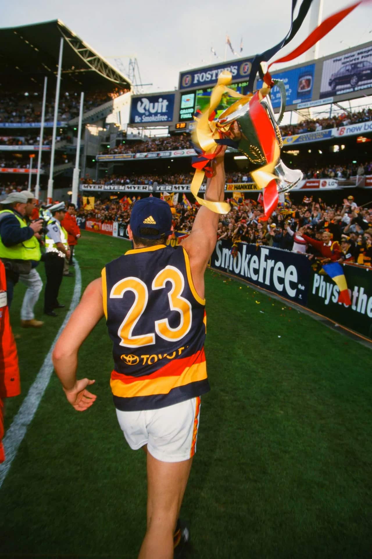 Andrew McLeod holds up the 1998 premiership cup. Picture AFL Photos