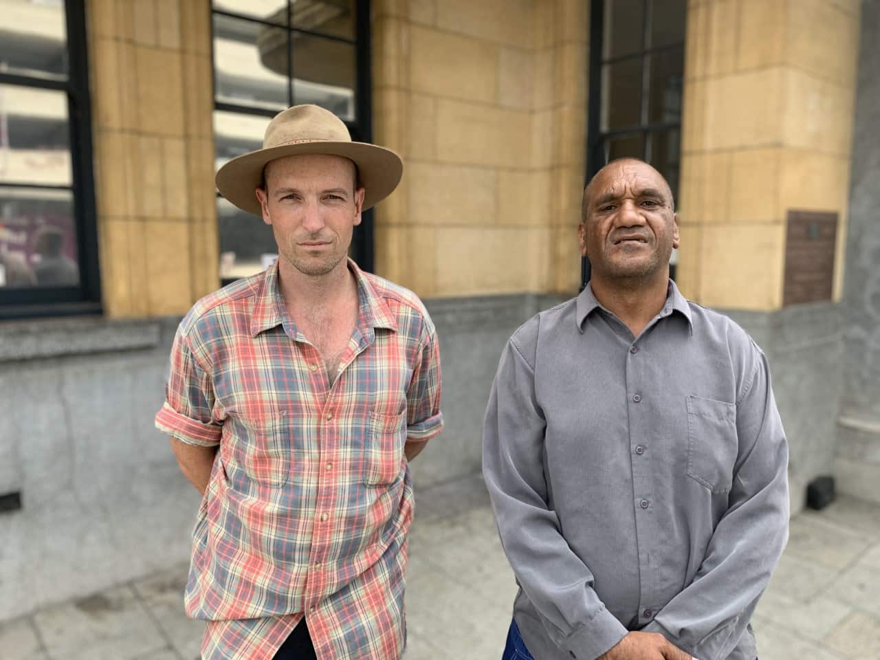 Advocate Jesse Noakes standing next to Desmond Blurton Cuiamara.