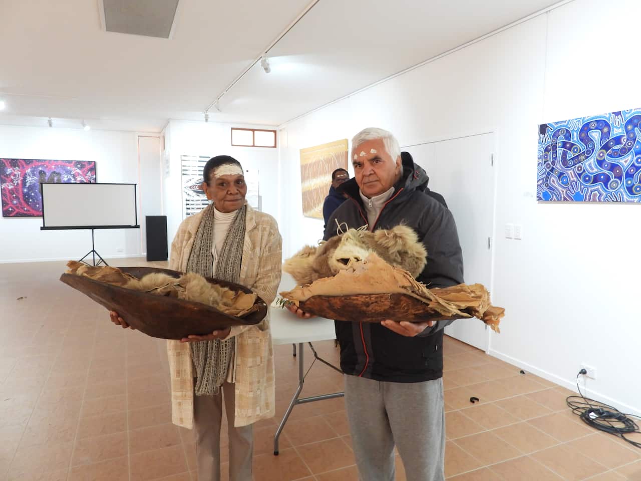 Cheryl Kitchener and Stephen Ahoy hold the remains of their Anaiwan ancestors. 