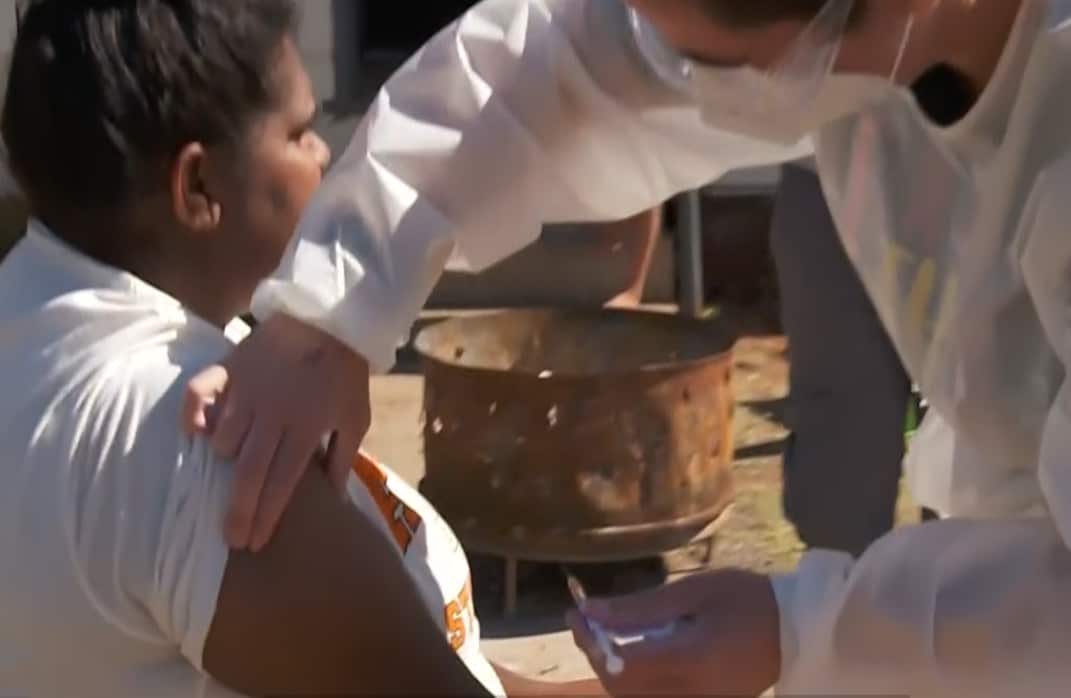 Woman being vaccinated in Enngonia