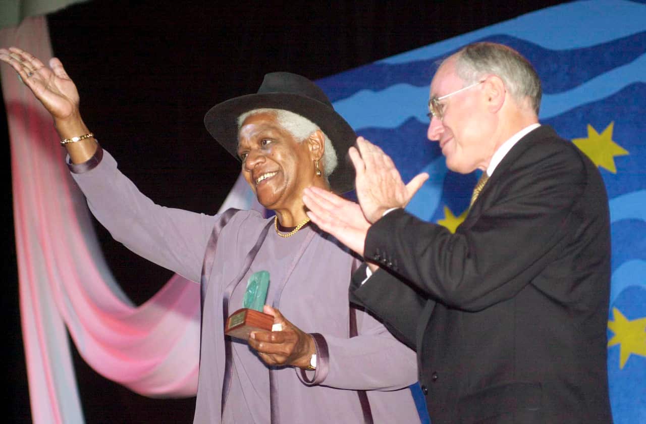 Former chair of the Reconciliation Council Evelyn Scott after receiving an Australian Achiever award from PM John Howard at the Australia Day Awards at Parliament House Canberra tonight(AAP Image/Alan Porritt)
