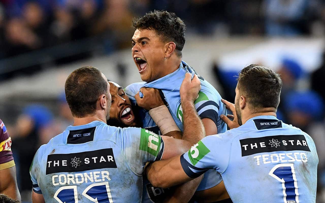 Latrell Mitchell of the Blues celebrates after he scores a try during Game 1 of the 2018 State of Origin series at the MCG in Melbourne