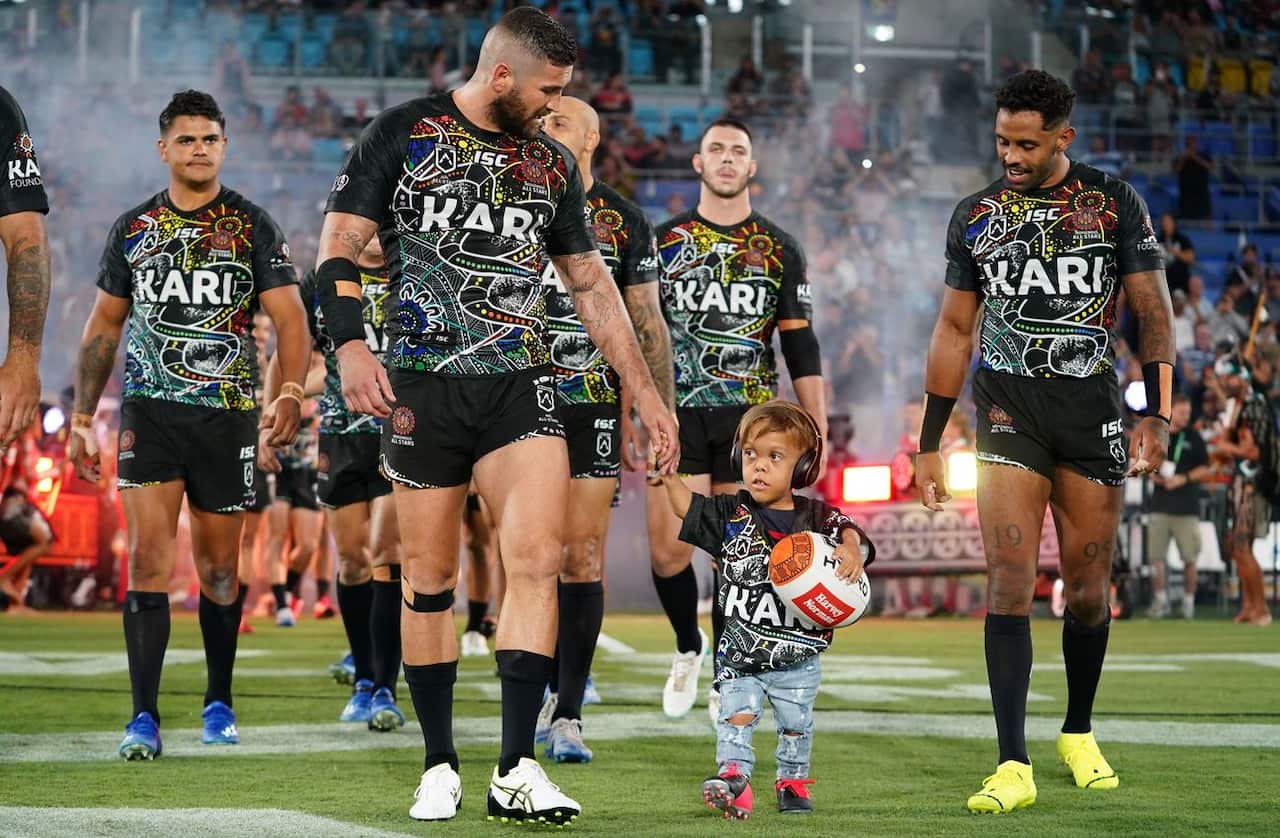 Quaden Bayles, (9), leads the Indigenous All Stars 