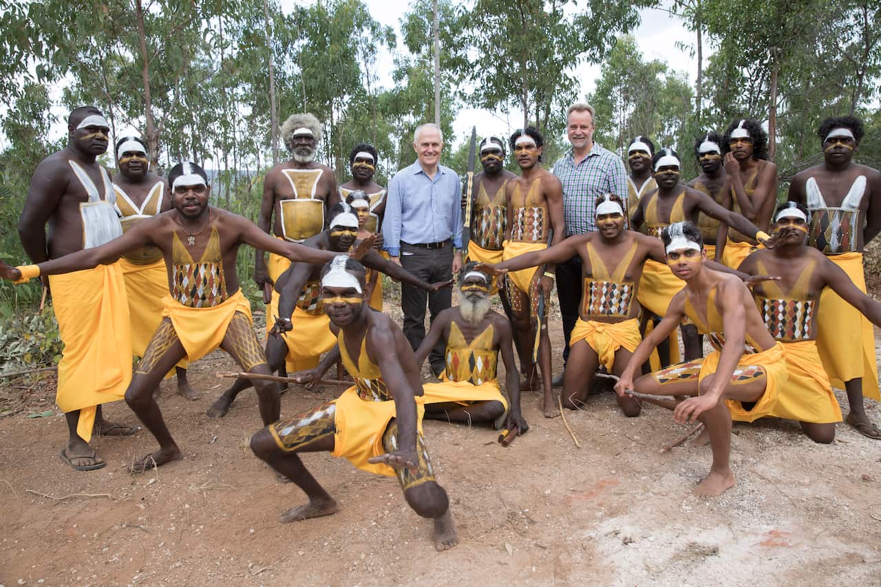 Prime Minister Malcolm Turnbull (left) and Minister for Indigenous Affairs Nigel Scullion with dancers from the Gumatj clan during the Garma Festival