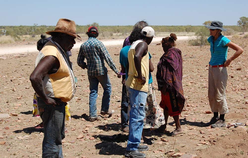 Dr Keryn Walshe (right) talking to members of the descent group at the massacre site.