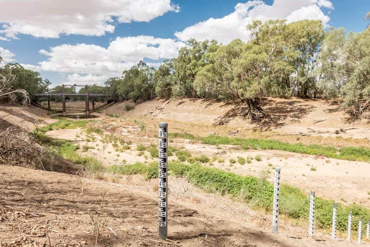 Exposed water height markers on the Darling River reveal the depth of the crisis at Wilcannia. John Janson-Moore