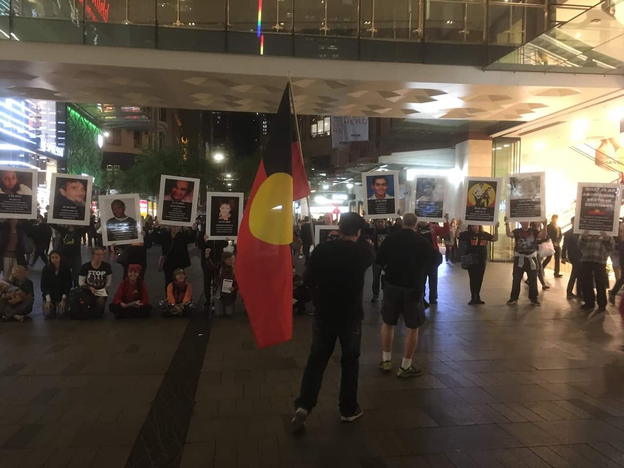 Uncle Ken Canning out front of a FIRE group bringing attention to the continued genocide through deaths in custody