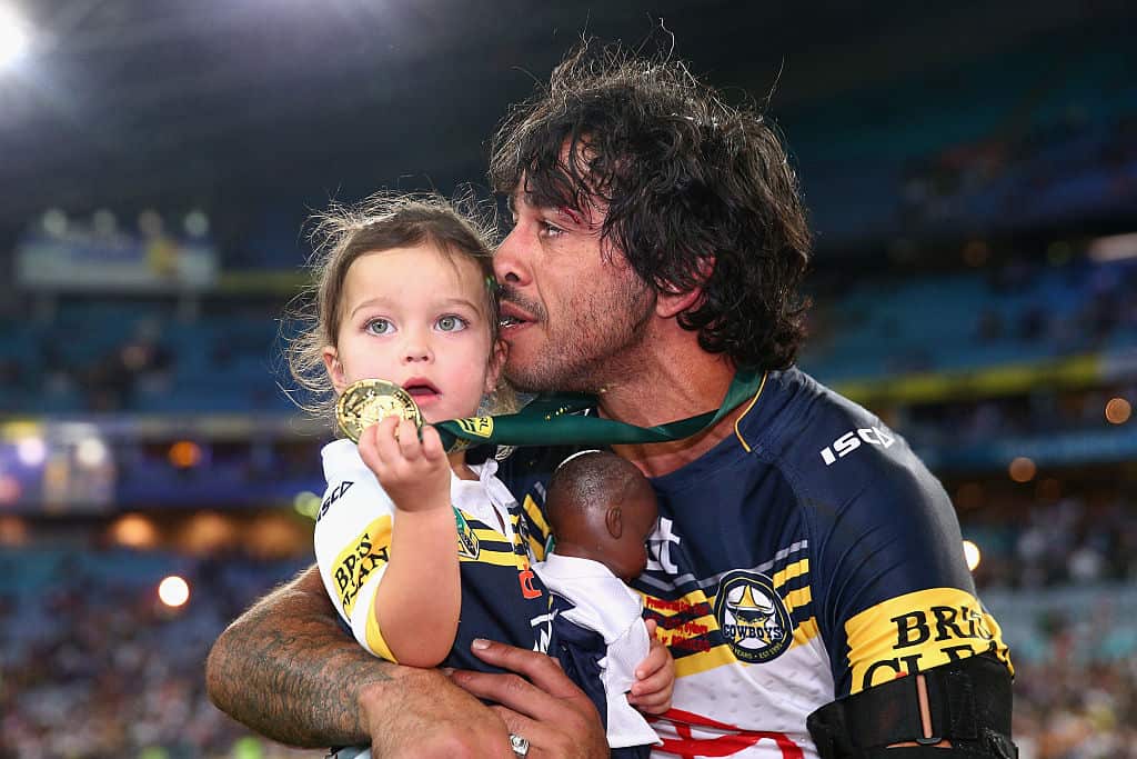 Johnanthan Thurston takes a moment with daughter Frankie after winning the 2015 NRL Grand Final
