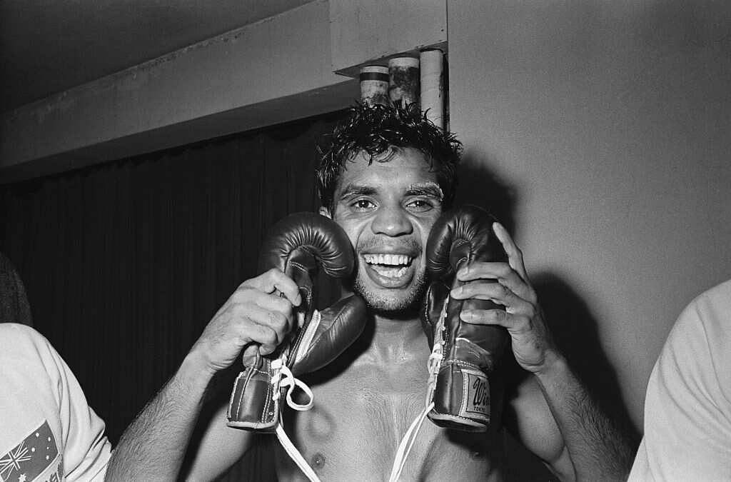 Lionel Rose Embracing his Boxing Gloves