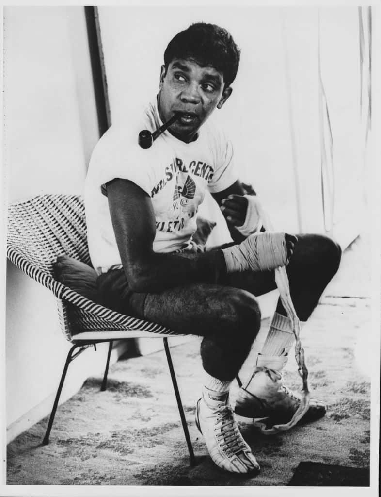 Lionel Rose Smoking a Pipe