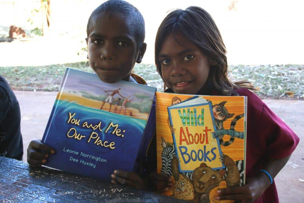Indigenous children reading books