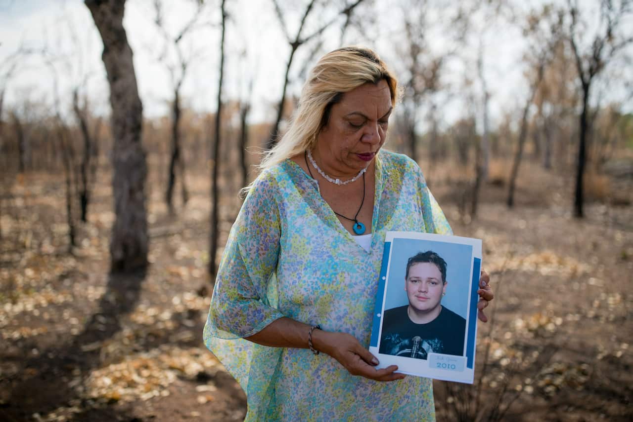 Glenice Grieves holds a photo of her son, Zak. 