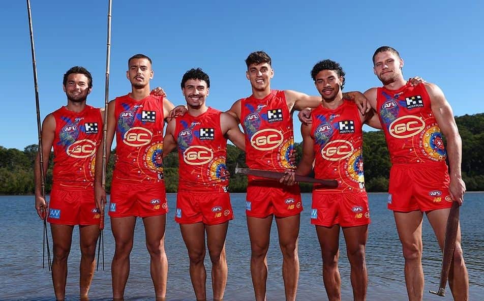 Suns players model the shirt on the team’s website