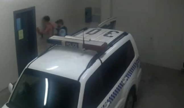 Police CCTV footage shows the moment Senior Constable Murray pushed Mr Little's head against the wall, which was one of the assault charges brought against him.