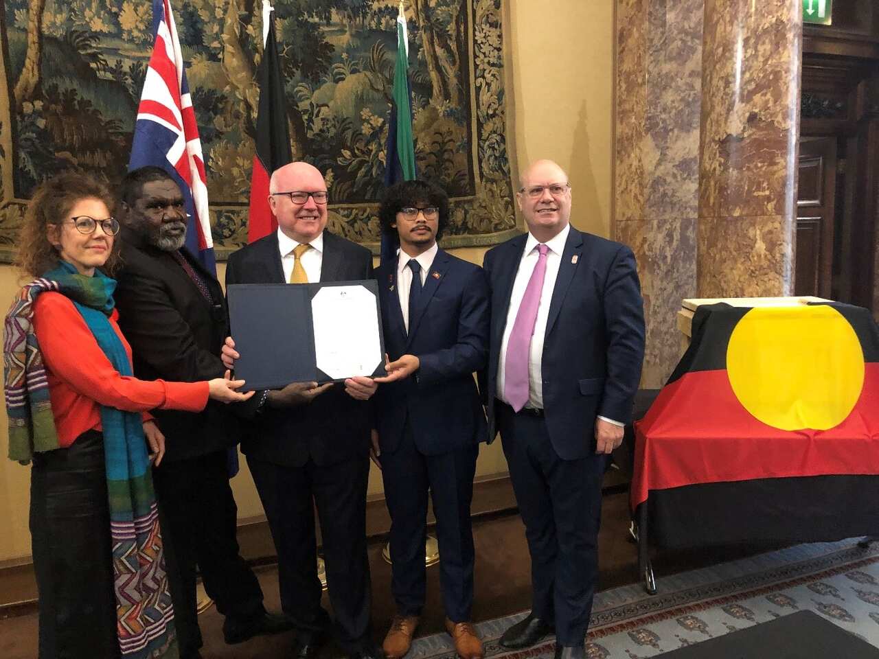 The official handback at Australia House with the Australian High Commissioner George Brandis and Manchester Museum Director Esme Ward, CEO of AIATSIS Craig Ritchie.