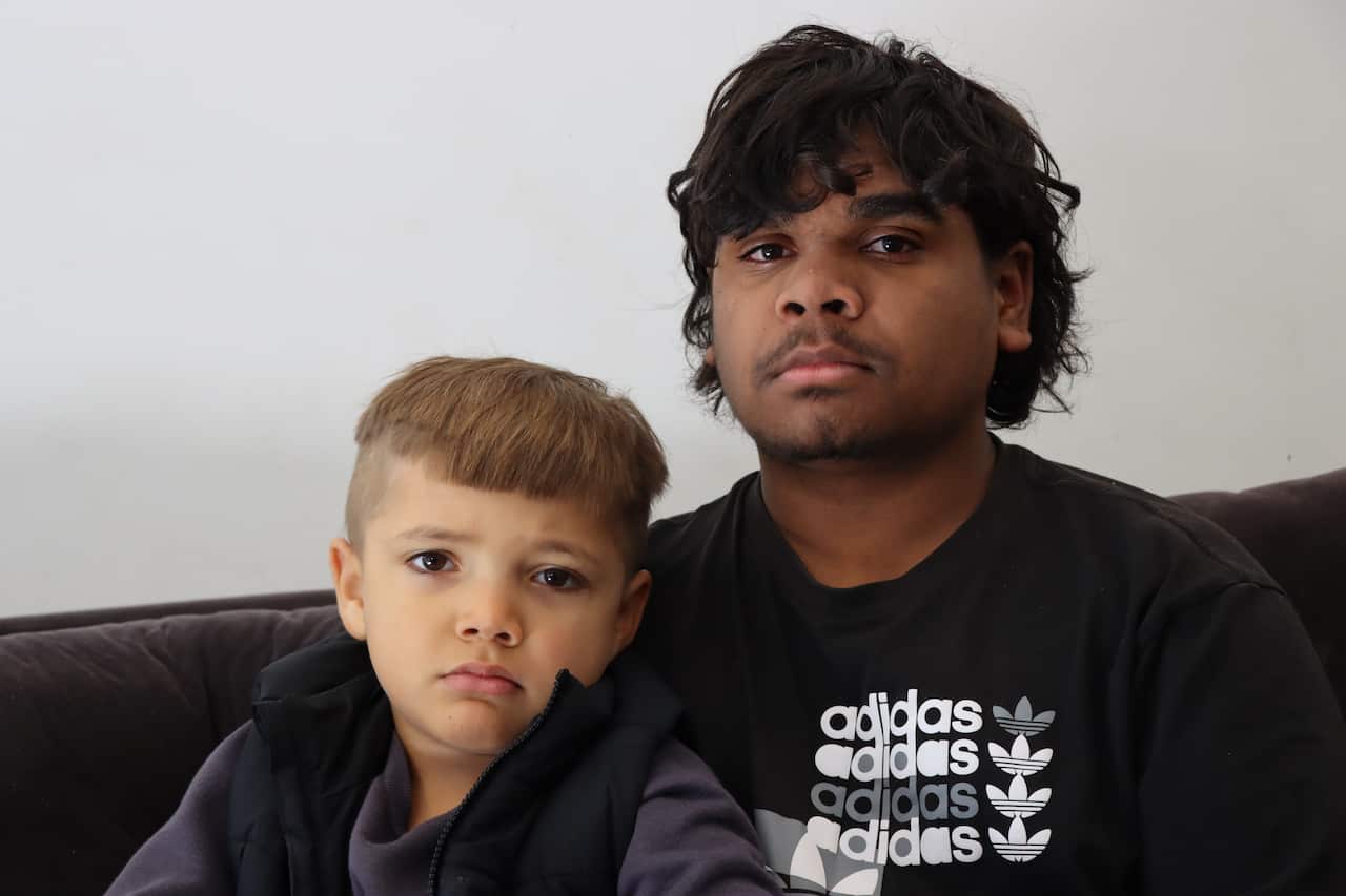 Harry sitting with his younger brother Blake