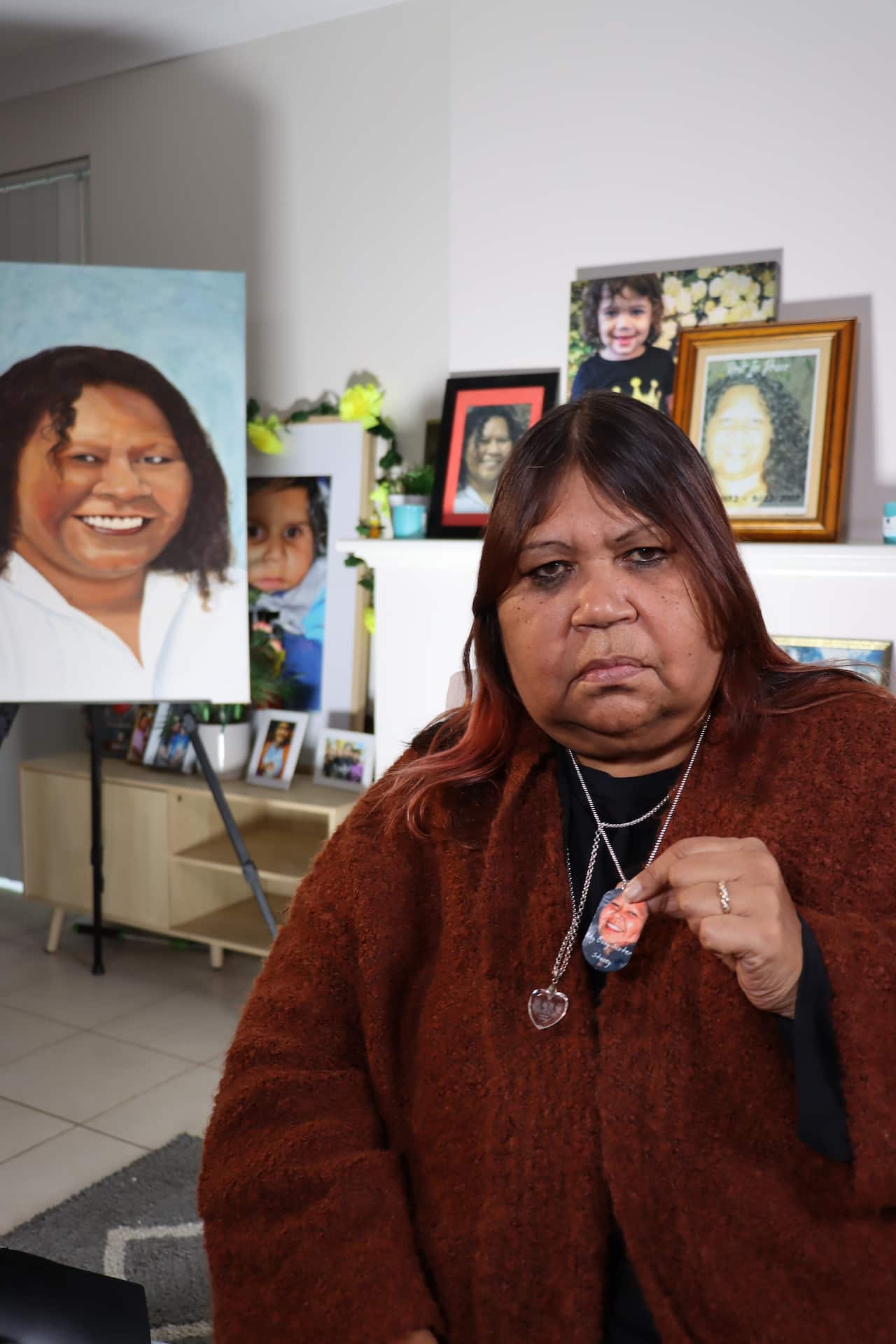 Hayley Thorne with photos of her late sister