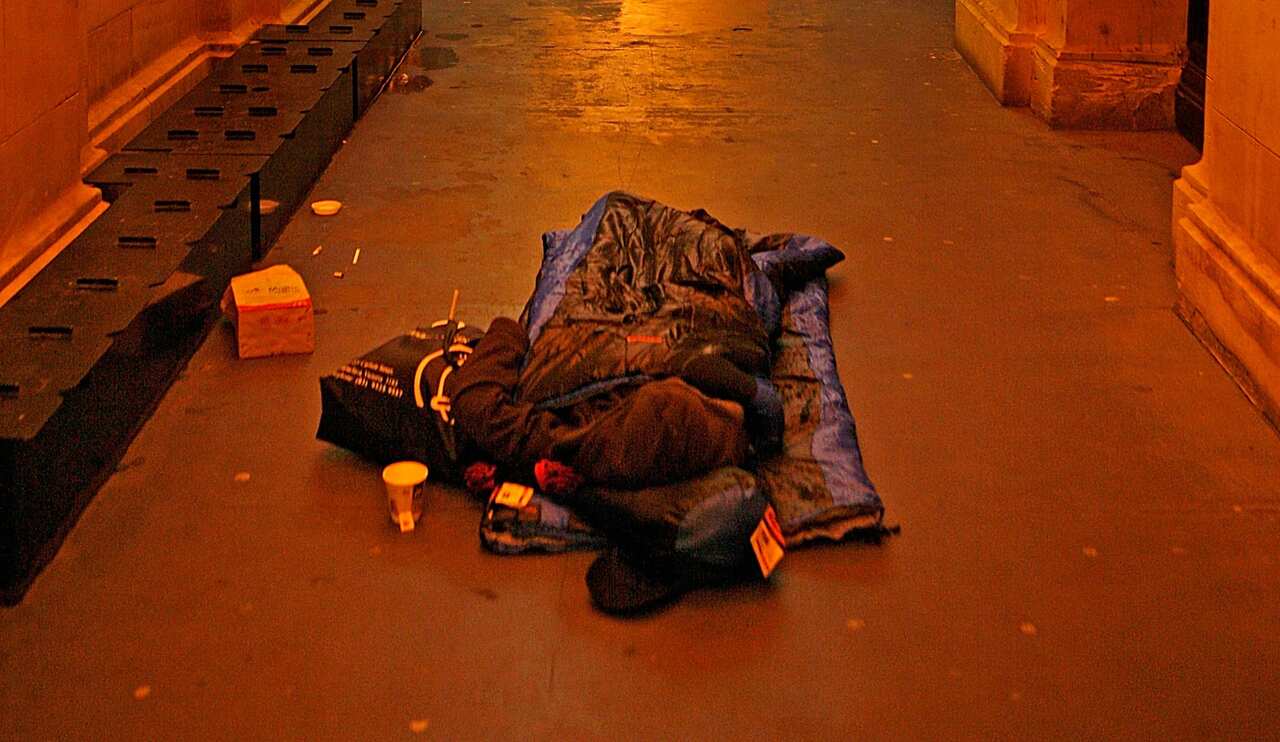  A homeless man sleeps on the street