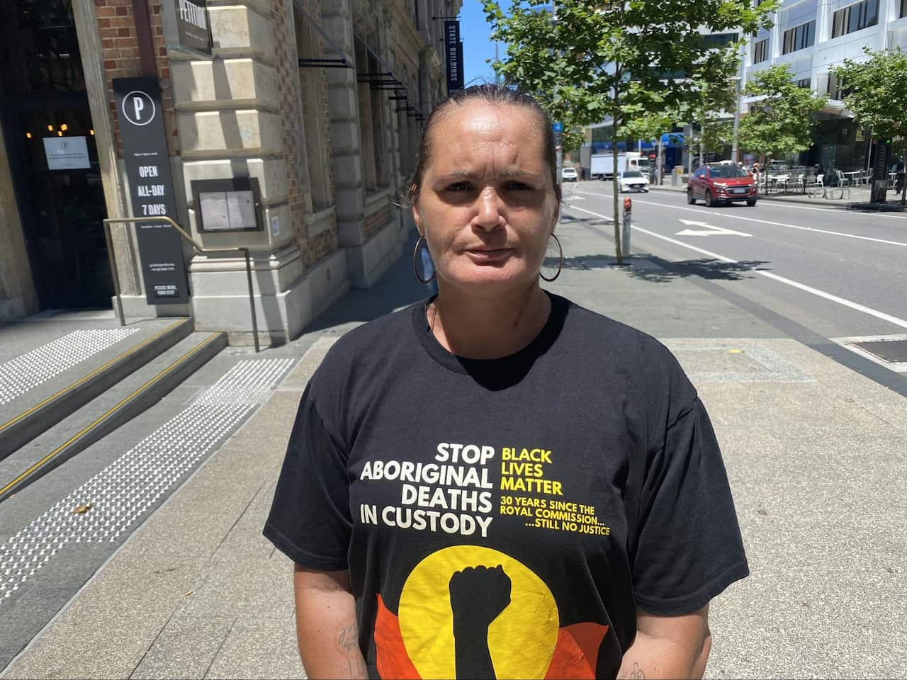 Marianne Mackay wearing a black lives matter tshirt on a street in perth.