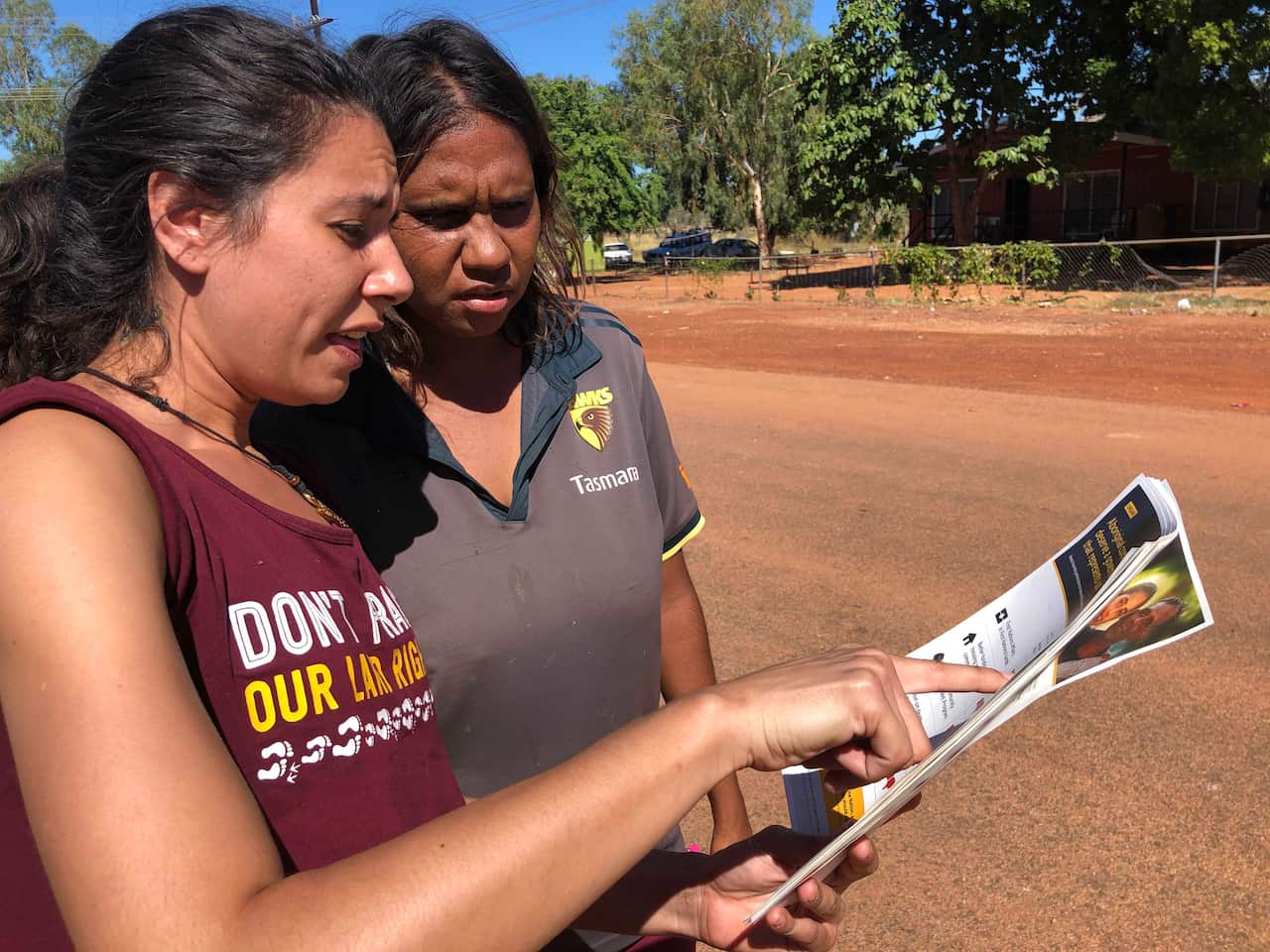 GetUp volunteer Maria Clague talks to a voter in remote NT