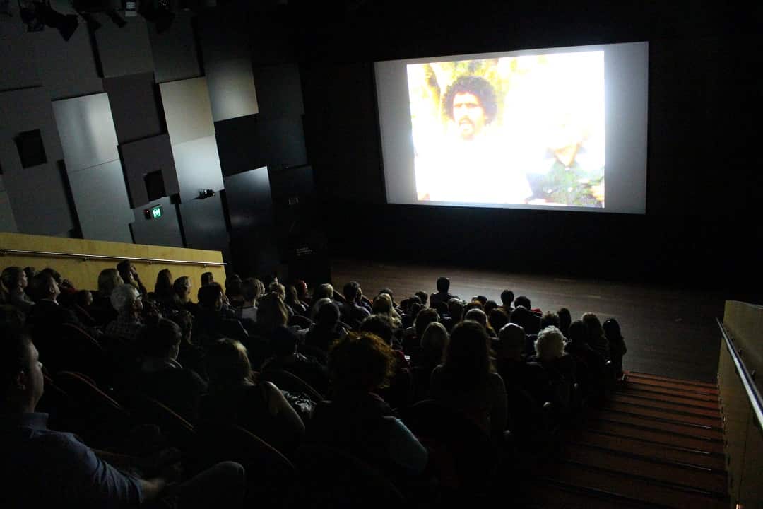 A captured audience watches 'WE FIGHT' at the Museum of Contemporary Art, Sydney, 2018.