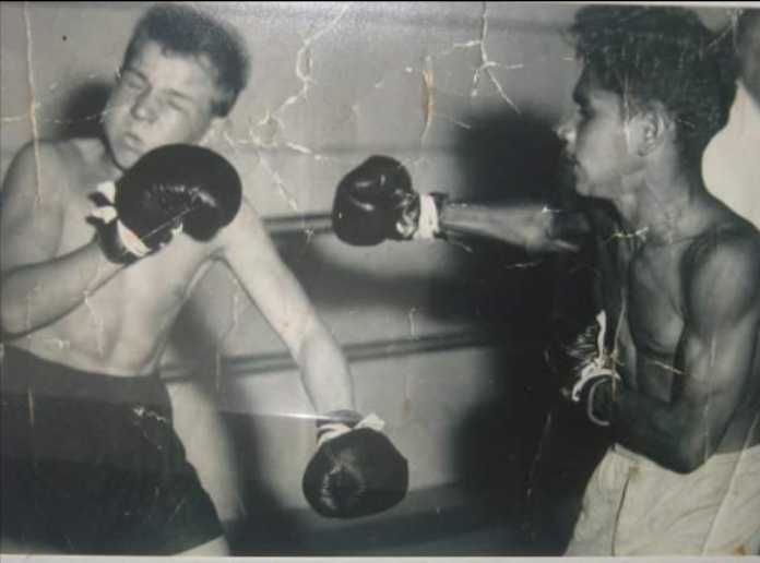 Uncle Les (right) in action against a boxing opponent in his younger years.