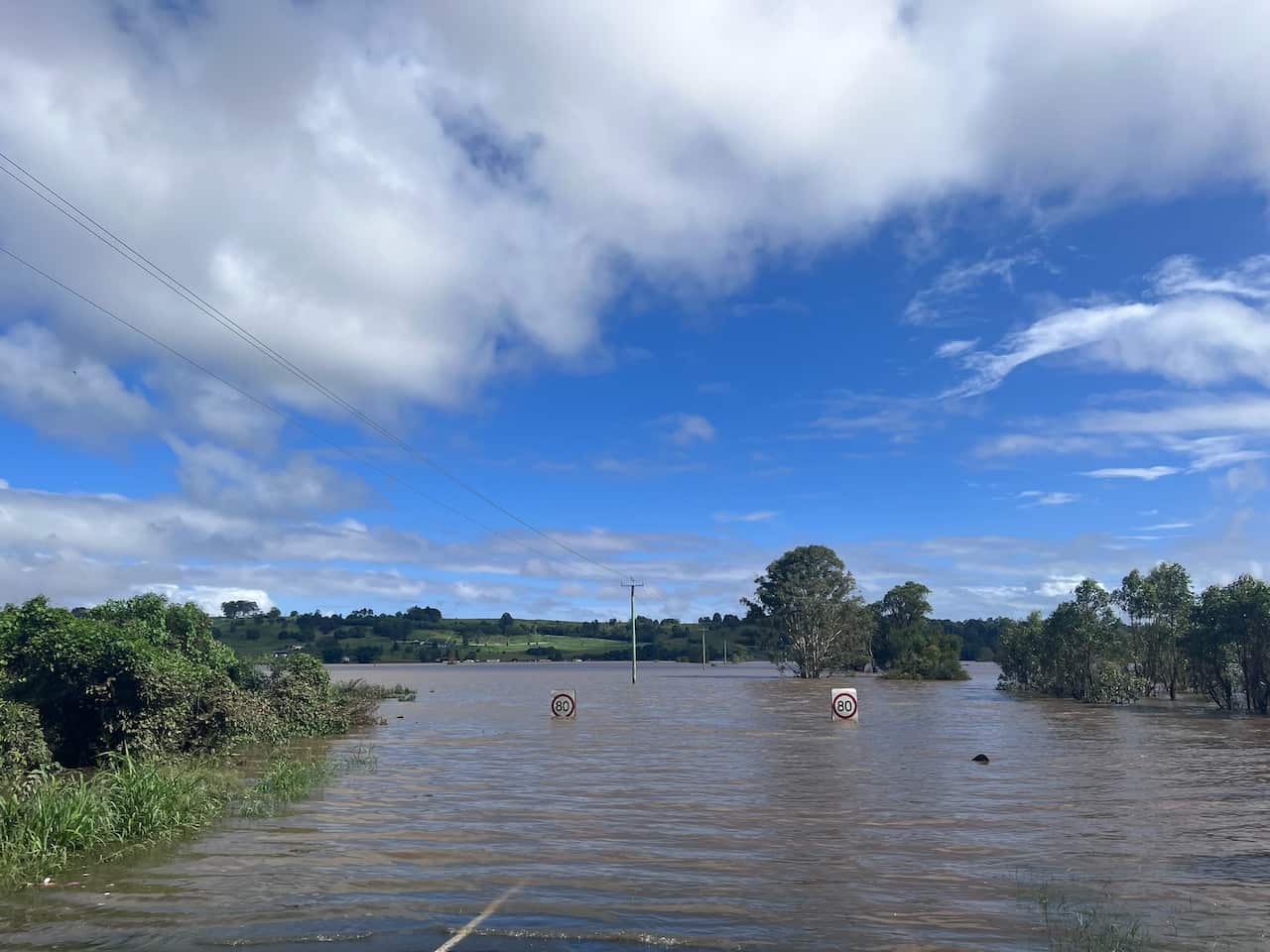 The road between Lismore and Gundarimba, which has been cut off by floodwater.