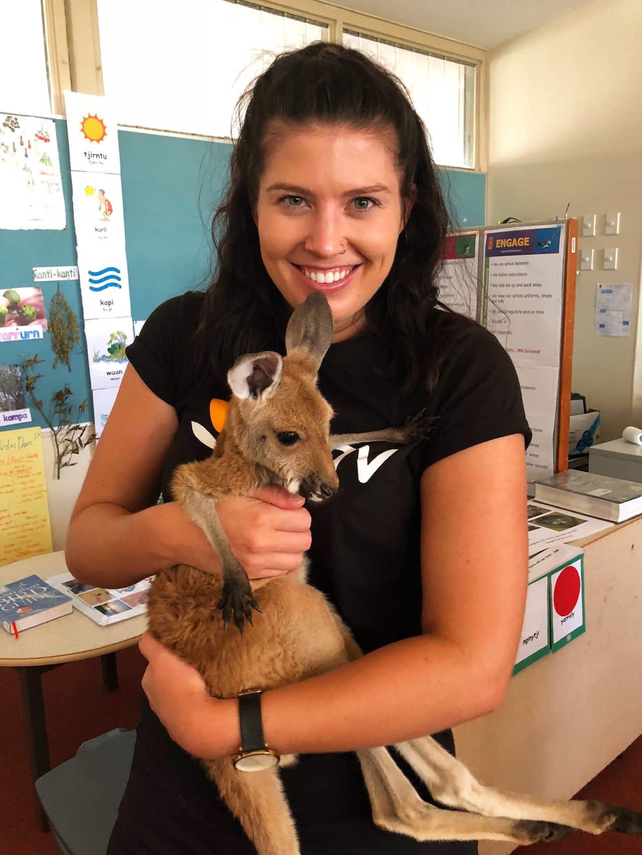 Author, Rhanna with one of three baby joeys being fostered by Aunty Fifi Harris in Leonora