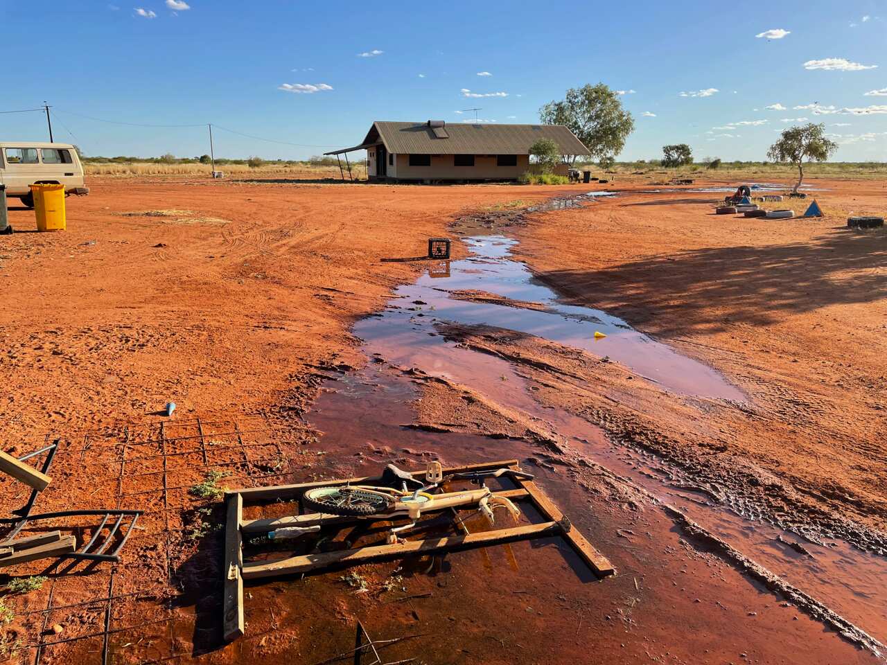 A house in the desert has water leaking on the property